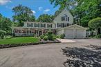 Welcome to this beautifully maintained 4-bedroom, 2.5-bath Colonial located in the heart of Port Jefferson Village and within the highly sought-after Port Jefferson School District. Situated on over half an acre of landscaped grounds, this 3, 900 sq. ft. residence blends timeless charm with modern luxury. A picturesque covered front porch invites you in, while the attached two-car garage and oversized driveway offer ample parking for up to eight vehiclesâ€”perfect for hosting guests or a growing household. At the heart of the home is a true chefâ€™s kitchen, thoughtfully designed for both culinary performance and everyday enjoyment. It features a 6-burner Viking stove with integrated grill & 2 Ovens and additional double wall ovens, warming drawer, stainless steel appliances, granite countertops, trash compactor, garbage disposal, and its own fireplace for added warmth and character. A custom glass ceiling enclosure above the kitchen immerses you in natural light and scenic surroundings, turning mealtime into an inspiring experience. This home offers multiple inviting living spaces, including a Four Seasons room, a formal dining room, a sunlit den with a pellet stove, and a spacious living room anchored by a gas fireplace. A separate bar area provides the perfect setting for entertaining, while oversized windows throughout the home fill every room with natural light. Four fireplaces throughoutâ€”including in the kitchen, living room, and denâ€”enhance the atmosphere and elevate the sense of comfort and elegance. Upstairs, the primary suite is a private sanctuary. It features a dual-sided gas fireplace, a spa-inspired en suite bathroom with dual vanities, a massive walk-in shower, and a luxurious jetted soaking tub positioned to overlook the fireplace. A personal sauna and an oversized walk-in closet complete the suite. From the primary bedroom, step out onto your private balcony and enjoy morning coffee or an evening unwinding in peace and privacy. Each additional bedroom is generously sized, providing flexibility for family, guests, or a dedicated home office. In ground front and back sprinklers, 5 year old roof &Partial Basement w/new hot water heater & water purifier. The homeâ€™s layout flows beautifully for both entertaining and everyday living, with custom touches and upgrades throughout that make it truly one-of-a-kind. The blend of formal and informal spaces, natural elements, and modern amenities creates a home that is as functional as it is refined. Located just minutes from the heart of famed Port Jefferson Village, residents enjoy easy access to the Port Jefferson Ferry, Long Island Rail Road, and a vibrant Harborfront filled with boutique shops, restaurants, and entertainment. For professionals and families alike, proximity to top-tier institutions like Stony Brook University Hospital, Mather Hospital, and Saint Charles Hospital adds an extra layer of convenience and peace of mind. This is a rare opportunity to own a luxury residence in one of Long Islandâ€™s most desirable and connected coastal communities.