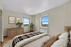 Motivated SellerWelcome to Unit 12C at the desirable Fordham Hill Oval, where comfort meets panoramic beauty. This spacious high-floor one bedroom co-op offers sweeping city skyline and Hudson River views that create a serene and inspiring backdrop to everyday living.As you step into this sun-drenched unit, you&rsquo;re greeted by an expansive living and dining area with oversized windows that flood the space with natural light. The layout is thoughtfully designed, offering both functionality and flow, perfect for relaxing evenings or entertaining guests.The generously sized bedrooms easily fits a king-size bed, and features ample closet space. The kitchen offers modern cabinetry, generous counter space, and full-sized appliances, making meal prep both stylish and efficient. A tiled bathroom rounds out the home with classic charm.Located in a beautifully landscaped, gated community, Fordham Hill Oval offers full-service amenities including on-site laundry, package room, and playgrounds. Just minutes from Fordham University, shopping on Fordham Road, and public transportation (B/D/4 trains and express buses), this home combines tranquility with urban convenience.