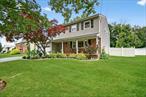 Welcome to this light and bright 4-bedroom Knusten Colonial located on a beautiful, quiet street just minutes from top-rated schools, Nanuet baseball fields, serene lakes, shopping, and major commuter routes. With a charming front covered porch and a 2-car garage, this home offers incredible curb appeal and everyday functionality.Step inside to find gleaming hardwood floors, a graceful side hall, and a beautiful banister that sets the tone for this warm and spacious home. The main level features a family room just off the kitchen, perfect for gathering and everyday living, with easy access to a true backyard oasisâ€”an oversized patio, fenced yard, large shed, and plenty of room to run and play.Upstairs, the dreamy primary suite features his-and-her walk-in closets, a luxurious oversized step-in shower, and a separate vanity area. Three additional spacious bedrooms offer generous closet space, with storage galore throughout the home.The finished basement provides bonus space for recreation, a home gym, or extra storageâ€”flexibility for all your needs. Don&rsquo;t miss this exceptional home near public transportation, shopping, and everything Nanuet has to offer. A must-see!