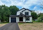 New construction Colonial features 3 bedrooms and 2 full bathrooms. Hard wood floors throughout and carpet in the bedrooms and ceramic tile in the bathrooms. White shaker kitchen cabinetsWith quartz countertops tops and stainless appliances. HVAC system. Full basement and one car garage.
