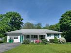 This pleasant, three-bedroom ranch sits unassuming on a green and level 1.29 acres in the midst of a peaceful neighborhood perfect for morning or weekend walks amid sycamore and pine, rabbits and goldfinch, and yes, even a proverbial babbling brook nearby. It is an easy home to maintain and weathers all climates well. All generations, from urban and rural areas, have enjoyed the placid verdant setting of the back yard from deck, patio, or panoramic living room windows. The dining/kitchen/living rooms have often happily embraced two dozen plus for many a holiday meal. And, white Christmases can also be celebrated in cozy comfort.There are apple, pear, and mulberry trees...as well as blueberry bushes...in the yard. Years of successful vegetable gardening, from corn to zucchini (and lots of tomatoes!), offer proof of fertile soil available for your tilling, if you wish. And the mature flower/shrubbery gardens surrounding the perimeter of the house greet you year round: daffodil, jonquil, iris, tiger lily, azalea, rhododendron, lilac, forsythia, etc., some over a century old.The house and property offer move-in ready functionality for those who need to hit the ground running...but, can accommodate any upgrades you prefer.Only a mile from the Taconic State Parkway and a few miles from I-84, there is easy access to commuter routes and a 75-minute ride to NYC.
