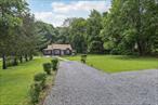 Situated on almost 1 acre in a two-family zone, this picturesque home is perfect for a first home, downsizing, or a weekend getaway. Become a member of the Mohegan Colony Association and enjoy a true community. Members have access to Lake Mohegan, private beach, boat dock, playground, basketball court, paddleball/handball court, and annual events. You can even throw your own lakeside party! The living room is anchored by a stately stone wood-burning fireplace. Enjoy cooking in the eat-in-kitchen with peninsula and ample storage. This home is made for outdoor entertainment, with its spacious patio, sport court, level yard, and direct access to the laundry room/mud room and full bathroom. You and your guests can spend all day outside and you don&rsquo;t have to worry about tracking dirt through the house! Relax in the 2 first floor bedrooms. Another full first-floor bathroom. The walk-up attic can be used for storage or convert it into more living space! The possibilities are endless! This home is registered with the 100% Money Back Guarantee Program. Sold AS IS