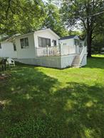 PRICE JUST LOWERED ! FUN AT SYLVAN LAKE Time is now to buy a get-away in beautiful, fun filled Dutchess County with its many vineyards & markets, small town fairs, plus many historic spots and houses. This seasonal co-op community Forest Lake, Hopewell Junction 12533 has beautiful sandy beach with a floating dock for swimming and a stationary dock to watch the ripples of the lake. Perfect spot for snow birds to visit family. Swimming, boating, fishing, hiking, tennis, basketball plus much more. This cottage has full kitchen, living room plus 2 bedrooms and a large deck. All in move in condition Plus a new shed to store life jackets paddles etc. The community is open May through October COME TAKE A LOOK AND YOU WILL LOVE WHAT YOU SEE.