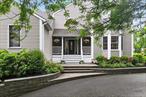Pride of ownership radiates from every corner of this beautifully maintained and spacious contemporary home, perched atop a circular driveway on a quiet cul-de-sac in one of Kingston&rsquo;s most desirable neighborhoods. Located just 90 miles from NYC and minutes from the vibrant Stockade District, this property offers the perfect blend of luxury, privacy, and convenience. Spanning 3, 770 sq feet, the home welcomes you with a grand foyer, high ceilings, and an abundance of natural light that fills the open layoutâ€”ideal for both entertaining and everyday living. To the right of the staircase, you&rsquo;ll find a cozy living room accented with a gas fireplace that seamlessly flows into the formal dining room. From there, step into the heart of the home: the kitchen and adjoining sitting area, which overlook the stunning heated gunite in-ground pool. Surrounded by a stamped concrete patio and a beautiful deck, this backyard oasis makes every day feel like a private retreat. The kitchen features stainless steel appliances, quartz countertops, a tile backsplash, ample cabinetry, and an oversized breakfast bar with plenty of space for cooking and entertaining. Just off the kitchen is a spacious family room, perfect for gatherings, complete with a convenient half bath. A generously sized primary suite is located on the first floor, offering a modern bathroom and ample closet space, with a washer and dryer conveniently located just outside the hallwayâ€”making single-level living easy and efficient. In addition, there is a half bath on the main level for guests. Upstairs, you&rsquo;ll find three additional bedrooms, including a second primary suite with a beautifully updated bathroom, modern vanity, spacious walk-in closet, and a private balconyâ€”perfect for enjoying your morning coffee and the peaceful sounds of the backyard waterfall. The remaining bedrooms are generously sized with ample closet space, and there is also a dedicated office with pull-down attic access for additional storage, plus a second full bathroom on this level. The lower level is currently set up as a game room and gym, with indoor/outdoor access that leads to the oversized two-car garage, plus an additional third garage bayâ€”ideal for storing all your seasonal toys and equipment. Conveniently located just minutes from the NYS Thruway, Trailways bus station, and all the best Upstate attractions, farmer&rsquo;s markets, and events. This is more than a homeâ€”it&rsquo;s an extraordinary lifestyle opportunity. Don&rsquo;t miss your chance to make it your own!