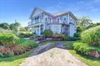 Custom Contemporary /Victorian Home With Spectacular Water Views & Direct Dock Access*Three Bedrooms* Huge Primary Bedroom W/ Ensuite *Soaking Tub & Three Walk-In Closets *Soaring Beamed Ceilings W/ Private Primary Water View Balcony* 14-Zone Radiant Floor Heating Throughout* Open Concept Kitchen/Family Room/ Raised Formal Dining Room* Integrated Thermador Refrigerator/Stainless Steel Appliances/36 Inch Commercial Gas Cooking Range/Electric Oven* 14 Foot Center Island *Breakfast Nook * Pantry Closet* Second Floor 26 x 20 Great Room Features Spectacular Views With Full-Width Balcony*Soaring 16 Foot Ceilings * Gas Fireplace* Wet Bar *Half Bath* First Floor Laundry Room W/Storage*Brazilian Hardwood Flooring With Custom Oak Inlay* Smart Home Controls Lighting, Locks, Appliances, Alarm, Temperature, Music, Fireplace, Blinds With Voice Control* First Floor Laundry Room W/Storage & Sink*Blown In Insulation In Exterior And Interior Walls For Maximum Energy Efficiency, Sound Proofing And Fire Protection * Dock Access for Boat Or Jet Ski *Fully Fenced Backyard W/ Double Door Electric Gate*Mature Landscaping With Front Yard Water Feature* Sprinkler System* 110 x 16 Foot Private Driveway & Additional Circular Driveway*A Truly Unique One Of A Kind Home.