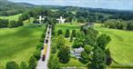 Welcome to This Hudson Farm â€“ a distinctive 157+ acre estate spanning 2039â€“2105 Salt Point Turnpike, where the beauty of the Hudson Valley meets the ultimate opportunity to enjoy as muchâ€”or as littleâ€”of the farming lifestyle as you desire. Positioned between Rhinebeck and Millbrook, and just minutes from the Taconic State Parkway, this remarkable offering blends historic charm with modern sophistication, creating an exceptional canvas for both purposeful living and long-term investment.The land is the heart of this property. With prime agricultural soils, gently rolling pastures, and mature woodlands of oak, maple, and birch, the landscape is as productive as it is picturesque. The farm supports both crop cultivation and livestock, and is equipped with substantial infrastructure: a full-scale 200-cow dairy barn, a large cattle barn with new fencing, and a horse barn with 9 stalls (5â€“6 of which are thoughtfully built out). Five well-appointed run-in sheds, multiple fenced paddocks, and a network of internal farm roads provide efficiency and functionality across the property. An inviting outdoor riding rink enhances the usability for equestrian interests.Natural features add to the propertyâ€™s exceptional characterâ€”four ponds, including one with its own island, are scattered across the acreage. A tributary to Wappingers Creek weaves through the land, enhancing its ecological value and year-round beauty. A high point on the property offers a spectacular site to build a custom home or retreat with panoramic views of your own rolling hills.Currently, the farm includes two primary residences. The main house is a thoughtfully updated 1940s farmhouse with 4 bedrooms and 3.5 baths, filled with natural light, classic details, and a comfortable blend of heritage and ease. Just across the property, the guest house offers an additional 4 bedrooms and 2 full baths, bringing the combined total to 8 bedrooms and 5.5 bathrooms between the two homes. A 2-bedroom apartment attached to a commercial structure provides added flexibilityâ€”ideal for farm staff or supplemental rental income.Income from three commercial and one residential tenant on-site currently generates monthly income, with potential for further growth if one chooses. Property taxes are just over $30, 000 annually, with the option to grieve the guest house assessment for additional savings.Whether youâ€™re seeking an income-producing working farm to retreat to on the weekends, every day, or a long-term land investment with flexibility built in, This Hudson Farm stands out as a rare offering in one of the regionâ€™s largest and most sought-after corridors.