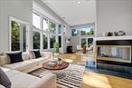 Tucked in the lush charm of Piermontâ€”where art, architecture, and Hudson River history meetâ€”this light-filled, four bed, four bath multi-level contemporary offers a unique blend of serenity and style. Only -30 minutes from Manhattan and located in the top-rated South Orangetown school district.Set over a half acre, your new home provides an extraordinary escape without sacrificing convenience, with direct access to the 10+ mile recreational Esposito Trail (Erie Path)â€”a gateway to natural beauty, luxurious privacy, rich history, and the allure of the village of Piermont.Built in 1992 with a modern eye for light and space, the home unfolds with intention. The entry-level welcomes you with a spacious foyer, direct garage access, powder room, and a generous kitchen. A marble pass-through connects the kitchen to the dining area, while sliding Andersen doors lead to two private decksâ€”one plumbed for grilling, the other made for lounging under the trees or entertaining al fresco.One level down, a cozy sunken living room with a wood-burning fireplace and a pellet stove offer warmth and comfort, surrounded by oversized windows with seasonal river views.Below that, the basement level features three generously sized rooms, including one with vaulted ceilings and a loftâ€”ideal for a creative workspace or playful hideaway. This floor also includes a full bath, laundry, ample storage, and even a kiln room tucked beneath the deckâ€”perfect for hobbies, gardening, or bike storage.Upstairs, the primary suite feels like a private wing, complete with soaring ceilings, dual walk-in closets, and a spa-inspired bath with soaking tub, separate shower, and abundant natural light. An adjacent family room with its own en-suite and mini-fridge doubles as a fifth bedroom, guest quarters, or home office.Throughout, the central staircaseâ€”lit by skylightsâ€”anchors the home with a soft, shifting glow. Central air, baseboard heat, Andersen windows, and thoughtful upgrades like reverse osmosis water filtration add comfort and quality.Outside your door, Piermont invites exploration. Dine at favorites like Roost, Ottoâ€™s, and Trata, stroll the village shops and galleries, or hike and bike along riverfront trails. Weekends offer easy access to Piermont&rsquo;s weekly Farmer&rsquo;s Market on Sunday, Nyack Beach Park and lively street fairs that remind you the best of culture and nature coexist here. This isnâ€™t just a homeâ€”itâ€™s a lifestyle. A quiet perch with room to create, recharge, and connect, close to the city but a world away. This is Hudson Living. Virtually staged/edited.