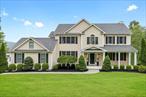 Welcome to this spectacular custom-built Colonialâ€”the move-in ready home youâ€™ve been dreaming of. Privately set back from the road, a long, picturesque driveway leads you to this serene oasis, impeccably maintained by these owners. No detail was overlooked in the careful selection of finishes and the superior quality throughout.Step inside to a gracious double-height foyer that sets the tone for the expansive and sun-filled layout. The heart of the home is the breathtaking open-concept kitchen and great roomâ€”ideal for everyday living and effortless entertaining. The kitchen features high-end appliances, abundant cabinetry, and seamless flow to the oversized deck, perfect for al fresco dining or enjoying the tranquil views of the beautiful backyard.Adjacent to the kitchen, the well-designed mudroom offers ample storage and everyday convenience. Upstairs, the private primary suite is thoughtfully set apart from the additional three spacious bedrooms. Each room enjoys generous natural light, custom closets, and plenty of space. The second-floor laundry room is an added bonusâ€”both practical and perfectly located.A light-filled open landing on the second floor currently functions as a home office, comfortably accommodating two desks and built-in bookcasesâ€”an ideal setup for remote work, study, or creative pursuits.Additional highlights include a built-in surround sound system in the great room and a whole-house audio system, enhancing both everyday life and entertaining. The walk-out lower level offers incredible storage and potential for future living spaceâ€”think gym, playroom, or guest suite.With a two-car attached garage and ample driveway parking, this home is as functional as it is beautiful. A rare opportunity to own a turnkey residence in a peaceful, private settingâ€”welcome home.
