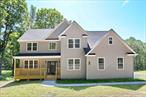 Commanding presence. Elevated living. Introducing 344 N Ohioville, a bold new construction masterpiece on 4.3+ private acres in New Paltz, ready for immediate move-in. With over 2, 800 sq. ft. of refined living space (plus a 1, 380 sq. ft. walkout basement), this 4-bedroom, 2.5-bath Colonial makes a statement at every turn. Soaring ceilings, radiant heated 48x48 stone tile floors, and a custom floor-to-ceiling fireplace define the two-story family room, a dramatic centerpiece made for both entertaining and everyday luxury.Open to the second floor above, itâ€™s ideal for both entertaining and everyday living. Oversized windows flood the space with light, creating the perfect blend of elegance and comfort. The main level also includes a private study with French doors, a formal dining room, 2 car garage access, and a stylish half bath. The open kitchen shines with quartz countertops, stainless steel appliances, a large island, and plenty of cabinetry, flowing into a cozy dinette. Upstairs, drenched oak hardwood floors lead to a luxurious primary suite with tray ceilings, a spa-like ensuite bath, soaking tub, walk-in shower, dual vanity, and an oversized walk-in closet. Three additional bedrooms share a full bath, a finished bonus room and a laundry room that includes a slop sink. A guard rail hallway adds architectural flair overlooking the family room below. The walkout basement with large windows offers potential living space with an optional finishing package. This all-electric, Energy Star-ready home includes high-performance insulation and energy-efficient HVAC, two separate high-efficiency condensers, each dedicated to its own AC unit, one for the upper level and one for the lower level ensuring customized comfort and energy efficiency throughout the home. Enjoy the peaceful setting from the covered front porch or spacious back deck with stairs to the backyard. Just minutes from downtown New Paltz, I-87, Empire State Trail, Mohonk Preserve, and Minnewaska State Park. Donâ€™t miss this rare opportunity!