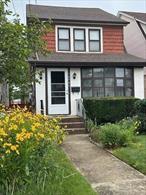 Welcome to this move-in home located in the heart of Queens with easy access to major highways, multiple bus and subway lines that reach Manhattan within a half hour. It is also near schools and shopping. The home features on the main floor a spacious living room which flows into a large formal dining room and an inviting kitchen with a sun drenched patio that overlooks Hoover Avenue. The house is situated in between 150th and Hoover Avenue.Upstairs you will find 3 bedrooms, one full bathroom and a finished attic with a large Cedar lined closet and other multiple storage spaces. You will also find hard wood floors throughout, a separate side entrance leading to the kitchen, to the unfinished basement and to the one car garage which is ideal for hassle free parking. New roof and new front storm door and new railing in front of the house. This house offers a perfect blend of city charm and convenience and with a few personal touches it can easily become your dream home.