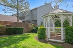 , Discover the charm of this Lake Isle Townhouse, where an inviting iron gate and brick pathway lead you to a serene courtyard entrance. Inside, find a spacious bedroom paired with a recently updated bathroom, and enjoy the convenience of in-unit laundry tucked away in a large hall closet. The heart of the home is the modern kitchen, boasting granite countertops, stainless steel appliances, and an eating area that overlooks the open-concept dining and living spaces. The extra-large living room is a cozy retreat with its beautiful fireplace and sliding doors that open to a private deck â€“ perfect for barbecues or relaxation. Soaring cathedral ceilings and high-hats add to the grandeur of this special room. Ascend the carpeted stairs to the loft area, complete with built-in bookcases and ample closets, offering a flexible space for an additional bedroom, den, or office. The primary bedroom suite is a true sanctuary, overlooking the front courtyard with extensive closet space, a deck and a recently renovated bath featuring both a soaking tub and shower. The lower level presents a very large, finished area (above ground) with an additional bathroom, providing extra space tailored to your specific needs. This VERY SPECIAL townhouse is a delightful place to call home. Schedule your visit and experience its unique allure.Reply, Reply All or Forward