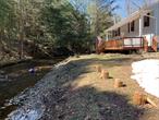 Just 2 hours from NYC, this extraordinary property in the heart of the Catskills (Long Eddy, NY) offers the ultimate escape. This rare property is a true gem, sitting on two lots totaling 10.78 acres. House sits on .688 acre with the adjoining lot totaling 10.78 acres. Built in 1985 renovated in 2020 from top to bottom. Featuring stunning natural scenery , a private creek stocked with rainbow trout that feeds right into the Delaware river and endless opportunities for recreation and relaxation. With wooded trails, and streams, the estate provides a variety of outdoor activities, from hiking to fishing and camping, Whether you&rsquo;re fly fishing or exploring the nearby Delaware River, this property is a nature lovers paradise. House features four bedrooms with den/office. Two full bath with waterfall shower in master bedroom. Butcher block top center island and living room views of basket creek. Short drive from the charming towns of Callicoon, Hancock, and Narrowsburg, known for their wineries, breweries, boutique shopping, and dining. This unique property offers endless possibilities - a private retreat, an Airbnb investment, or a future retirement retreat this property in the Catskills is truly one-of-a-kind.