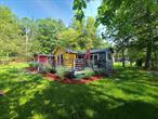 Your Smallwood search is over! Beautifully situated at the end of a dead end, this fun cabin offers a serene setting with a peaceful babbling brook running through the property. Offering an open plan with 3 BR&rsquo;s and 2 BA&rsquo;s, fireplace and game room. The primary bedroom has a soaking tub in the room for that spa experience at home. The open deck looks out over the water and the pretty landscaped yard. Cross over the foot bridge to your little slice of heaven and the perfect place to relax and unwind. This cabin is situated in the Smallwood lake community offering lake access with beach and boat launch as well as tennis, playground, clubhouse and more. Hiking trails, waterfalls and state-of-the-art dog park are also nearby. Bethel Woods is a 10 minute drive!