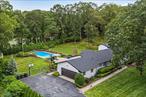 Welcome to 9 Midvale Court in East Northport! This stunning sprawling Ranch offers a luxurious primary En Suite with a large walk-in closet, along with three generously-sized bedrooms. Enjoy the convenience of 4 full baths and one half bath. The Chef&rsquo;s Kitchen is equipped with top-of-the-line Bosch appliances, custom cabinetry, an oversized center island, and elegant quartz countertops. Beautiful marble flooring flows throughout the home. The open floor plan includes a formal living room and dining room, perfect for entertaining. The laundry area features a newly installed doggy shower stall for added convenience. This home has been upgraded with new roofing and siding. Outside, you&rsquo;ll find an oversized patio and built-in pool, all set on 1 acre within a private cul-de-sac. The property also includes a two-car garage and an oversized driveway for ample parking.