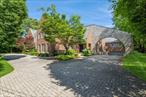 Prepare to be captivated by this extraordinary brick and stone mansion at 475 Ocean in Lawrence, offering timeless elegance and modern luxury. Step inside the grand marble entry with soaring floor to ceiling windows that flood the home with natural light. The main level features a lavish primary suite with his and hers bathrooms, dressing rooms and a private terrace. There are six additional bedrooms with en-suite bathrooms. Entertain in style in the banquet-sized formal dining room, complete with butler pantry and washing station. A formal living room and spacious den provide space for grand gatherings, The chef&rsquo;s eat in kitchen and sunlit breakfast room open to a spacious terrace. Work or unwind in library/office lined with custom built- ins. The fully finished basement features a den/ playroom, full kitchen and pantry, gym, huge laundry room and a private guest suite with a bedroom, bathroom and small kitchen area. Outdoors, indulge in resort like living with a sparkling pool and a pool house offering its own full kitchen, laundry and baths. All of this sits on magnificent landscaped grounds in one of lawrenc&rsquo;s premier locations