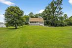 Looking to get away from it all? Why not do it in style in this classic Cape style home in a quiet, scenic section of Pine Bush Schools. With 3/4 bedrooms and 3 full baths. The updated eat-in kitchen features stainless steel appliances, hardwood hickory 5 plank floors, subway tile backsplash, and room for all the family. The large living room is light and bright and has hardwood hickory 5 plank floors and a wood burning stove to keep the home nice and comfy. The 1st floor master bedroom has a huge updated bath with dual sink vanity and large walk-in closet. Natural stone slate floors on the way upstairs. Updated bath with new vanity and ceramic tile floors and 2 bedrooms. Both upstairs bedrooms have new floors and walk-in closets. Downstairs you&rsquo;ll find a finished basement with a full bath. Roof is only 4 years new and has a whole house attic fan, and 1.1 acres of beautiful property with a 2 car garage. Their is a lot ot offer here. This wont last long because this is not just a house this is a HOME!