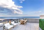 Enjoy modern coastal living with NYC skyline and ocean views at this beautifully appointed two-bedroom, two-bathroom residence with a private balcony at One Sixteen, a premier luxury condominium just moments from the sand and surf in Rockaway BeachPerfect for morning coffee, sunset cocktails, or taking in the horizon beyond, the private balcony offers a rare sliver view of both the Atlantic Ocean and the Manhattan skyline, blending city excitement with beachside serenity.Inside, expansive floor-to-ceiling windows usher in natural light and coastal breezes, accentuating the clean lines and modern finishes throughout. The open-concept living and dining space flows effortlessly, with a thoughtfully designed layout.The contemporary kitchen is both stylish and functional, featuring honed Carrara Quartz countertops, a full suite of integrated stainless-steel LG and GE appliances (including a gas range and dishwasher), and a peninsula breakfast bar that adds storage and seating for four, in addition to ample space for formal dining. Retreat to the king-size primary suite, complete with a luxurious five-piece en-suite bathroomâ€”double vanities, a glass-enclosed shower, and a deep soaking tub create a personal spa-like escape.A second king-sized bedroom has an en-suite three fixture bath, offering comfort and privacy for residents and guests alike.Additional highlights include a dedicated laundry center, with a Bosch washer and ventilated dryer, six-inch European white oak plank flooring, and ample closet space throughout.Building Amenities include two resident lounges and the Eighth Floor Club, offering a sweeping entertainment space with dazzling water and skyline vistas and an incredible landscaped rooftop deck with panoramic views from the ocean to the NYC skyline.The welcoming lobby hosts an on-site attendant and a full-service fitness center. There is also bicycle and resident storage available, and on-site valet parking.Situated moments from the beach, One Sixteen offers the best of both worldsâ€”tranquil coastal living with convenient city access. Explore local cafes, surf shops, and Rockawayâ€™s vibrant boardwalk scene, or hop on the A train, Rockaway Ferry, LIRR, or Belt Parkway for a quick connection to Manhattan and beyond.
