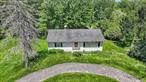 Tucked away in a peaceful, wooded setting, this affordable ranch offers an incredible opportunity for first-time buyers, downsizers seeking one level living with easy access in and out of the home, or investors. Set on nearly 4 acres of serene land, this property features a detached two-car garage, ample yard space, and the kind of privacy thatâ€™s hard to find. While the home does need some TLC, it offers solid bones and endless potential. Whether you&rsquo;re looking to renovate and resell or update for long-term living, this is a rare chance to own acreage in a quiet, rural location without breaking the bank. This property truly needs to be toured to be full appreciated, stop clicking and start dialing!