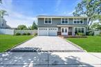 Large 5 Bedroom Brookfield Colonial with 2 Car Garage, Desirable Hauppauge Schools, Side Walks, New Eat In Kitchen with Quartz Counters, New Appliances, Finished Basement with OSE, Large Shed, Wood Floors, Large Rooms and Closets and More !