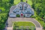 Discover luxury living in this expansive 5-bedroom, 4.5 bath home on prestigious Lake Drive in Hewlett Harbor. Offering elegantly appointed interior space, this residence combines timeless architecture with modern amenitiesâ€”ideal for grand entertaining and comfortable family living. Featuring a grand foyer, formal living and dining rooms, and a chefâ€™s kitchen with Wolf appliances, three sinks and two dishwashers flowing into a family roomâ€”ideal for seamless entertaining. High-end appliances, custom cabinetry, a large island, and breakfast area with serene views stun guests. Double walk-in closets, spa-style en-suite bath, and private sitting area overlook lush grounds of the golf course.  Commuter-friendly location with easy access to the Hewlett LIRR station, major highways, private clubs, and recreational facilities. Nearby communities like Lynbrook, East Rockaway, and Woodmere provide shopping, dining, and leisure amenities.