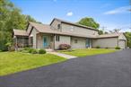 Tucked away yet just minutes from the heart of New Paltz, this 3-bedroom, 2.5-bathroom custom-built contemporary sits on 3.9 lush acres and delivers the ultimate live, work, and play lifestyleâ€”with a private in-ground pool, tranquil pond, and breathtaking Shawangunk Mountain views as your everyday backdrop!Just a short drive from the vibrant village center, youâ€™ll find everything that makes New Paltz one of the Hudson Valleyâ€™s most beloved destinationsâ€”farm-to-table dining, independent shops, weekly farmerâ€™s markets, live music, art galleries, and miles of protected trails. Whether youâ€™re spending your morning hiking the Mohonk Preserve, grabbing lunch on Main Street, or working remotely from your screened-in porch, this home supports the full rhythm of life here.From the curved driveway and manicured grounds to the soaring ceilings and sun-soaked interiors, every detail reflects pride of ownership and timeless craftsmanship. The open-concept main level flows effortlessly from the formal living and dining areas into a thoughtfully renovated kitchen, where granite countertops, custom cabinetry, and an oversized picture window frame postcard-worthy views of the mountains and water.Step out to your screened-in porch, then head poolside for a swim or settle by the pond with a fountain, watching wildlife as the sun sets behind the ridge.The first-floor primary suite offers privacy and comfort, while an adjacent home office makes remote work a breeze. Upstairs, two spacious bedrooms and a full bath are connected by a loft-style balcony, offering light, space, and more incredible views.Whether youâ€™re looking to unwind, entertain, or create a sanctuary for your next chapter, this home delivers a rare blend of elegance, functionality, and the raw natural beauty that defines the Hudson Valley.Only 90 minutes from NYC, yet a world away.