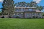 This 5 bedroom Colonial, totaling 3700sqft, is situated on a rare .82 acre in desired E. Setauket neighborhood. Spacious main living rooms include formal living & dining rooms, eat-in kitchen, sun drenched office with custom built-ins and a grand den with vaulted ceiling, skylights, fireplace and sliding doors to pool. The expansive primary suite is the perfect place to unwind from the day with new hardwood floors, surround sound speakers, trey ceilings, 2 walk-in closets, dressing area and bright ensuite bath, complete with spa tub and separate shower. Additional living space with a den, game room, full bathroom and work room in the basement. The exterior offers a variety of entertainment spaces: gated raised deck, fenced yard, inground gunite pool area (new filter and pump) and separate expansive athletic field. Updates include roof, siding, windows, CAC handlers, kitchen, hardwood floors through 2nd floor, 200 Amp electric and house generator. Located a few blocks from Frank Melville Park, weekly farmers market, art galleries and nature preserves. Idyllic life with space for all.