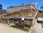Enjoy this 6 bedroom Ocean beach single family home with attached private cottage. Heated salt water pool. Raised to meet FEMA requirements.
