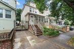 Welcome to 26-33 94th Street, a fully detached single-family home in East Elmhurst featuring three bedrooms, one and a half baths, a private driveway, and a fully enclosed backyard. Zoned R3, this property offers added flexibility for future expansion or long-term investment potential, all situated on a 24 x 117 lot. The main level offers a flexible layout beginning with an enclosed sunroom/foyer with triple front-facing windows. Inside, youâ€™ll find a spacious living room with carpeting over original wood floors, a formal dining room with a deep closet tucked under the staircase, and an eat-in kitchen with direct access to the yard. Upstairs are three bedrooms, two queen-sized and one ideal for a twin or full, along with a full bath showcasing classic black-and-white tile and an upgraded vanity. A crawl-space attic is accessible via hallway hatch. The unfinished basement features a half bath, washer and dryer, and offers ample room for storage or future finishing. The home features a newer roof, replaced approximately five years ago, a repaved private driveway, and includes three new window A/C units. Located just blocks from Astoria Boulevard and minutes from the Grand Central Parkway and LaGuardia Airport, youâ€™ll also have easy access to the Q33, Q47, and M60 buses, with connections to the 7, E, F, M, and R trains. Nearby parks include Gorman Playground, Astoria Heights Park, and Flushing Meadows-Corona Park, with shops and restaurants on Northern Boulevard just a short distance away.