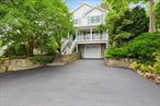 Welcome to 24 Midland Avenue, we believe to be the only Hurtado built custom home in the Village of Port Jefferson. Stunning craftmanship and quality. Perfectly maintained and lovingly cared for, just put down your furniture. Formal living room, palatial country kitchen with stainless steel appliances and granite counters, cozy den with gas fireplace, Spacious primary suite with full bath and ample closet space, three additional bedrooms. Extensive molding work, gleaming hardwood flooring, new carpets and freshly painted. Enjoy all the modern comforts..... central air, central vacuum,  IGS, leases solar panels, garage with opener, walkout finished basement, stand up attic .... cozy porch looking out onto the most amazing Crepe myrtle you&rsquo;ve ever seen. Your back yard is a bucolic oasis, quiet, private and serene... relax and enjoy the peaceful waterfall and sounds of nature.... All this in the historic New England like harbor front Village of Port Jefferson with hourly ferry service to New England. The Village affords you private beaches, Village parking, tennis, Harbor Hills Golf Club, the Village center with winter ice skating, Harbor front park, with its weekly farmers market,  and countless shops and restaurants. Near by, enjoy Stony Brook Village with its quaint shops, restaurants, Village Green and historic post office. Sand Street Beach and West Meadow Beach await your visit, Avalon Park and Preserve- a local treasure. Museums- The Jazz Loft, The Reboli Center, The Long Island Rock and Roll Hall of Fame, The Long Island Museum, a Smithsonian affiliate- Renowned health care with Stony Brook Hospital- Suffolk County&rsquo;s only level 1 trauma center, St. Charles Hospital and Mather Hospital all a short car ride away. Down the road is a LIRR train station at Port Jefferson which can whisk you right into the most exciting city in the world- see a game, take in a show- and one of the most prestigious public universities in the country, Stony Brook University. All this in the highly acclaimed and sought after Port Jefferson Central School District. Countless family memories will be made here! ..... It won&rsquo;t last long! Taxes $11 724.17 + $1, 988.90 Village = $13, 713.07 before STAR savings