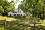 A classic, c1790 Hudson Valley farmhouse on 120 acres, you own as far as the eye can see. An incredible property of open fields, forest and streams, old stone walls and wildflower meadows. The home looks out over a large, beautiful pond surrounded by weeping willows and old sugar maples, and an in-ground pool sits out back amongst perennial gardens. The home is gracious with high ceilings and large common spaces. The living room has a wood burning fireplace and exposed beams, natural lights floods the space through the french doors leading to the pool. The kitchen has been beautifully redone with inset cabinetry, and a snug at the back of the home features a wood burning stove. A loft space above is the perfect place for an office, itâ€™s currently set up with camp beds for fun sleepovers. Youâ€™ll find two full baths on the main floor and an office with a gas fireplace. Upstairs there are four spacious bedrooms, all with beautiful views of the property out of classic, six-over-six windows. Wander a path past the pool and youâ€™ll find a beautiful stone fire pit, and a three-bay barn completes the picture. In the winter, enjoy ice skating on the pond & cross country skiing through the trail network, all without ever leaving your property. The 120 acres feel like a world of your own, all within 20m to Catskill proper with its fabulous shops & restaurants, and under 30m to Hudson/Amtrak. 2.5h north of NYC.
