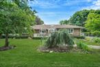 Welcome to 2 Clearbrook Dr, Smithtown â€“ a spacious 3-bedroom, 2-bath ranch located on a quiet dead-end street in the desirable Village of The Branch. Set on .55 acres, this 2, 159 sq ft home offers an open-concept kitchen with quartz countertops, stainless steel appliances, a gas stove, cathedral ceilings, and recessed lighting. An abundance of natural light fills the home, thanks to multiple skylights and large windows. Features include natural gas, Marvin & Andersen windows, CAC, 200-amp electric, and an alarm system. Entry foyer with double closets, tons of storage, and a huge full basement with outside entrance (Bilco doors). The beautifully landscaped, fully fenced yard includes two sheds, an above-ground pool with deck, newly sealed oversized driveway with 50 & 30 amp hookups, and in-ground sprinklers. Wired for whole-house audio. Total taxes including Village (before STAR): $15, 110. Smithtown School District. Close to shops, restaurants, LIRR, and highways. A must-see!