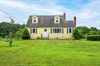 Charming Cape Cod in the village of Pawling, one owner since it was built in 1953. The home has been well maintained throughout the years. The interior was painted 2 years ago and there are recently installed windows throughout. There are 2 BR&rsquo;s on the first floor, a living room with wood fireplace & hardwood floors. The eat in kitchen has Corian & butcher block counters, a gas range & refrigerator. The back door leads to the deck overlooking green space & a frame for a tarp over the deck. There is a big full bathroom with tile floors downstairs. Upstairs 2 spacious bedrooms with carpeting & a spot where one could install a second bathroom. The basement is full, holds the utilities & washer & dryer hookup. There is a one car garage with a workbench. This is a very cute Cape Cod with plenty of potential. It is close to Lakeside Park, the trains, the village centre & places of worship. There is a shed for extra storage outside the garage.