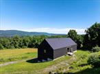 Set on 20.10 gently rolling acres along one of Columbia Countyâ€™s most picturesque roads, this striking barn offers a rare blend of utility, design, and future residential potential. Located on sought-after High Meadow Road in Copake, NY, the two-story structure spans approximately 3, 000 square feet and is currently utilized for high-end storage. Built with top-tier infrastructure, the barn features geothermal heating and cooling, radiant heated floors, and a half bathâ€”making it a prime candidate for conversion into a stunning residence, studio, or creative live/work space. Expansive windows and elevated positioning reveal sweeping views of the surrounding valley, all the way to the Taconic ridgeline, offering sunrise brilliance and pastoral tranquility in every direction. This property combines modern functionality with timeless rural beautyâ€”an exceptional opportunity to craft a dream escape or versatile compound in one of the Hudson Valleyâ€™s most bucolic and coveted settings. Just minutes to Hillsdale, Hudson, and Great Barrington.