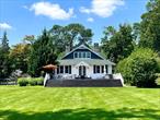 The 1930s was a storied time in Greenwood Lake, when Babe Ruth could be found fishing from an east arm dock, Greta Garbo was having cocktails at the Continental Hotel or Harlem Renaissance poet Langston Hughes was entertaining an A-list of literary luminaries. It was also when many of the craftsman homes were built in Greenwood Park, one of Greenwood Lakeâ€™s premiere private communities. Here residents enjoy a private beach thatâ€™s just steps away from the house, yoga classes commence on the pier and sunsets are unmatched. Enjoy lake life at its best from the expansive lawn, walk into water concrete stairs, and 50-ft dock with dockside water and electric that can accommodate 2 boats in the desirable no wake zone of the lake. The fully fenced backyard is complete with a new firepit area, an outbuilding office/studio and a detached garage turned game room. Ideal for entertaining with its sweeping staircase from the back deck that naturally extends to the great lawn, formal dining room and living room with a grand fireplace this classic craftsman maintains all the charm and details of its era, while incorporating improvements like a new roof, new kitchen and appliances, new bathroom, central air conditioning, and many more extras. Itâ€™s truly a 1 of 1 property that celebrates, art, architecture and a life well-lived. Property is a registered and established short term rental.
