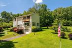 Escape to the tranquility of country living in this charming 3 - bedroom home nestled in the western end of Sullivan County in the Town of Fremont. This home offers a peaceful retreat with ample space for both indoor and outdoor activities. The home has not one, but two generously sized living rooms, offering versatility for various activities and gatherings, added bonus of a wood stove for those cozy nights. The family room also has a Juliet balcony that has been updated. The kitchen has all the appliances you need to create a feast. There is plenty of storage space with a 2-car garage detached and also a 1 car garage attached. The property offers 4 acres on two separate lots, lots of aged fruit trees and plenty of space for outdoor family get togethers. Location of the property is ideal, 20 minutes to Town of Callicoon and the Delaware River if you enjoy fishing and boating, 30 minutes to Bethel Woods, if you enjoy concerts, 20 minutes to Roscoe and 2 and half hours from NYC.