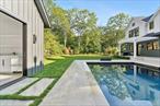Nestled in the heart of Sag Harbor, this stunning 6, 631sq. ft new construction home is situated on .52 acres moments from Sag Harbor Village. Boasting 6 bedrooms and 8.2 bathrooms, the thoughtful layout coupled with high end finishes and amenities creates the perfect haven for entertaining and enjoying all season long from the spacious double height foyer, sun-filled great room with floor-to-ceiling, custom chef&rsquo;s kitchen with oversized island, butlers pantry, formal dining room, first floor junior primary and office. Ascending to the second level, the primary bedroom beckons with a fireplace, private balcony, sitting room, and a spa-like primary bathroom with soaking tub and dual sinks. Three additional bedrooms, each with their own walk-in closet and bathroom, offer unparalleled comfort and privacy married by a sitting room for all to enjoy. The expansive lower level was designed with wellness and entertainment in mind, featuring a gym, sauna, temperature-controlled wine cellar, large recreational area with wet bar, media room, and additional ensuite bedroom with full bathrooms. Outdoors, the estate presents an exquisite retreat with an 40&rsquo;x20&rsquo; pool and 256+/- sq. ft. pool house, professional landscaping, and expansive porcelain patios for dining and lounging, offering the ultimate in outdoor and outdoor entertainment.