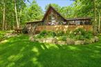 Lakefront Mountain Chalet with Exceptional Privacy & Views. Tucked away on a private cul-de-sac, this stunning 4 bedroom, 2 1/2 bath lakefront chalet offers over 2, 300 sq ft of refined rustic elegance on 5.26 beautifully landscaped acres. The home features gleaming hardwood and tile floors, a soaring cathedral ceiling, a cozy fireplace, and a gourmet kitchen ideal for entertaining. Enjoy panoramic lake views from the wrap-around porch, or unwind in the soaking tub after a day outdoors. The spacious layout includes a loft, dining/game room, large basement, and an impressive wet bar perfect for hosting. Outdoors, a stone patio, gorgeous gardens, gazebo, and private dock that provides direct access to a Glacier Lake for swimming, boating, fishing, and sailing. Additional highlights include central air, a lofted layout flooded with natural light, and access to endless recreation hiking trails, antique shops, and local farmers markets. Just minutes from the Delaware River, Bethel Woods Performing Arts Center, and the Kadampa Meditation Center and only two hours from NYC. A truly special retreat for year-round living or weekend escapes. Call today for your private tour. You wonâ€™t be disappointed.