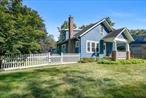 Timeless charm, curb appeal, and fantastic location in the Chappaqua School District. This Cape Cod home sits on a level and fenced property on a neighborhood street with a cul-de-sac. Step inside from the inviting covered front porch into the sun-filled living room with a wood-burning fireplace. The adjacent dining room flows seamlessly into the updated kitchen with a heated floor and a door that opens to the stone patio. The main floor also features two bedrooms and a full bathroom. Upstairs, there is a family room, office or den, primary bedroom, and another full bathroom. The full unfinished basement with laundry, a workshop, extra storage, utility area is connected to the garage and has enough space for 2 cars parked in tandem. Other highlights include solar panels, hardwood flooring, an open layout, and a location that offers the ideal blend of neighborhood living and convenient access to schools, shopping, and commuter routes.