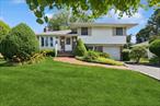 Wonderful split in mid-block location. Hardwood floors, ceiling fans, new windows, sliders to deck. Large backyard with deck and shed.