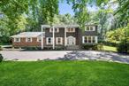 Set on a lush, private acre in the heart of Woodbury, this beautifully maintained Colonial offers timeless curb appeal, generous space, and the kind of quiet privacy thatâ€™s hard to come by.With over 3, 800 square feet, the home features 5 bedrooms, 3 full and 2 half bathrooms, and a flexible layout made for easy everyday living and seamless entertaining. The kitchen is updated with stainless steel appliances and opens into multiple living spacesâ€”whether youâ€™re hosting a holiday dinner or just cozying up by the fire. The standout is the oversized primary suiteâ€”truly a retreat of its own. With plenty of space to unwind, a dedicated home office nook, and a private bath, it offers the comfort and breathing room youâ€™ll appreciate every single day.Downstairs, the finished basement with 8-foot ceilings gives you bonus space to make your ownâ€”think gym, playroom, or media hangout. And outside, itâ€™s a true escape: mature landscaping, flat lawn, and an in-ground heated pool set the stage for summer lounging or low-key weekends at home.Add in a 3-car garage, top-rated Syosset schools, and a location that feels tucked away yet close to everything, includes a tesla EV plug!â€”this home checks all the right boxes.