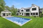 Tucked away on a peaceful cul-de-sac, 12 Rolling Wood Lane is a newly completed estate that embodies East Hampton luxury at its finest. Finished in 2023, this exceptional 7-bedroom, 10.5-bathroom residence spans approximately 8, 200 square feet and sits on nearly two acres of meticulously landscaped grounds, offering a seamless blend of classic architecture and modern sophistication. Step inside to discover a light-filled interior thoughtfully curated for elevated living. The gourmet chefâ€™s kitchen is a showpieceâ€”featuring marble countertops, an oversized center island, and professional-grade stainless steel appliancesâ€”designed for both everyday comfort and grand-scale entertaining. An elegant flow connects the formal living room, expansive great room, family room, and dining room, creating multiple spaces to gather and unwind. For work or retreat, the home offers a private office, cozy study, state-of-the-art media room, and a fully equipped gym. Each of the seven bedrooms is designed with comfort and privacy in mind, boasting en suite baths and refined finishes throughout. The primary suite is a private sanctuary, complete with a spa-like bath and an expansive walk-in closet. Additional highlights include a charming breakfast nook, three fireplaces, a discreet guest suite, and multiple areas for relaxation and quiet reflection. Outdoors, the estate continues to impress with a 20â€™ x 40â€™ gunite pool, outdoor shower, screened-in porch, and generous patio and deck areasâ€”perfect for al fresco entertaining. A three-car attached garage, long private drive, and top-tier systemsâ€”including central air, forced air heating, alarm, and private septicâ€”offer both comfort and security year-round. Every detail of this exceptional East Hampton estate has been designed for effortless luxury, privacy, and timeless appealâ€”a rare opportunity in one of the Hamptonsâ€™ most coveted enclaves.