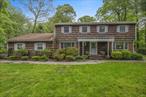 Elegant Center Hall Colonial In Woodburyâ€™s Prestigious Hunting Hills. Set On Over One Private Acre In The Sought After Syosset School District, This Over 3000 Square Foot Colonial Blends Timeless Elegance With Modern Luxury. Featuring Five Bedrooms And 3.5 Baths Including A First Floor Guest Suite, This Home Impresses From The Moment You Enter Itâ€™s Marble Foyer.Enjoy A Sun Drenched Custom Kitchen With Radiant Heated Floors. Dual Bosch Wall Ovens, Sub-Zero Refrigerator And Freezer, And A Solarium With Itâ€™s Own Thermostat. Entertain In The Formal Dining Room With Custom Built Ins Or Relax In The Cozy Den With Wood Burning Fire Place With Views Of The Resort Like Back Yard. Step Outside To A Heated Gunite Pool, New Patio And Pergola, And Private Cabana With Full Bath, Changing Area And Fridge. The Finished Basement Includes A Fully Equipped Gym, Pantry, Cedar Closet, And Laundry. Additional Features Include Hardwood And Porcelain Floors Custom Closets, Anderson Windows, Energy-Efficient Systems, Multi-Zone Sprinklers And A Two Car Attached Garage With In Home Entrance. A Truly Special Home In One Of Woodburys Most Prestigious Neighborhoods.