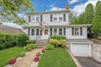 Welcome to 23 Jackson Avenue, a charming and well-maintained Colonial nestled in the desirable Battle Hill neighborhood of White Plains. This inviting home offers classic curb appeal with a neatly landscaped front yard and welcoming walkway. Inside, the sun-filled layout is ideal for both everyday living and entertaining. The bright living room features a cozy fireplace and flows into the kitchen with quartz countertops and direct access to the backyard, perfect for easy outdoor dining and grilling. The spacious formal dining room connects the kitchen and living room, while a bonus room off the main living area offers flexibility for a home office, den, or playroom. Upstairs are three bright bedrooms and a large hall bathroom. The private, fenced-in backyard provides a peaceful retreat with a patio and covered area, ideal for barbecues, dining, or simply relaxing. Additional highlights include beautiful hardwood floors, crown moldings, a full basement, walk-up attic, and a one-car attached garage offering plenty of storage. All of this is set in a prime location close to downtown White Plains, the Metro-North train (just 36 minutes to Manhattan), major highways, parks, and more.