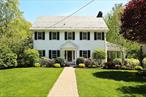 Welcome to this picture-perfect Center-Hall Colonial, where classic architectural beauty meets modern-day comfort. Nestled on a tree-lined street in the coveted Edgewood neighborhood, this gracious home has been lovingly maintained and thoughtfully updated, offering the perfect blend of tradition, warmth, and functionality. The main level welcomes you with a light-filled living room, complete with a cozy fireplace and built-insâ€”ideal for relaxing with a book or gathering with friends. Step onto a large, covered porch, perfect for enjoying warm summer evenings or morning coffee in the breeze. Host unforgettable dinners in the formal dining room, and enjoy everyday ease in the sunny, eat-in kitchen, featuring a picturesque window overlooking the lush backyard and direct access to a grilling-ready deck. A convenient powder room rounds out the main floor. The second floor offers a well-designed layout with a spacious primary bedroom and separate bath. Three additional bedroomsâ€”each generously sizedâ€”share an updated hall bath, offering space and flexibility for family, guests, or a dedicated home office. A private third-floor suite with its own full bath provides the ultimate guest retreat, teenage hideaway, or work-from-home sanctuary. Ample storage space ensures everything has its place. The finished lower level offers even more living space, including a large family room with built-insâ€”perfect for a playroom, media room, or gymâ€”plus an additional powder room, laundry area, and abundant storage. Direct access to both the backyard and the attached tandem garage adds everyday convenience. Professionally landscaped front and backyards set the stage for relaxation and entertaining. Enjoy dramatic uplighting that highlights the homeâ€™s charming facade. Located just a short walk to Edgewood Elementary and minutes from Scarsdale Village, Metro-North, and multiple shopping centers, this home offers the perfect balance of suburban tranquility and everyday convenience. The friendly, walkable neighborhood and true curb appeal make this a rare find. Donâ€™t miss your opportunity to own this timeless Colonial in a prime Edgewood location!