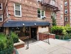 Welcome to the heart of Forest Hills! Come see this spacious Two bedroom/Junior 4 apartment for rent in a desirable Queens location. Situated in a well kept and well maintained Coop building, only 1 block to Queens Blvd. (M and R trains and Express and local buses). This unique apartment has amazing high ceilings, a spacious and open Living Room with big Eastern facing windows, Dining room with Hardwood floors, windowed Eat-in-kitchen with dishwasher, stove and new refrigerator, and plenty of cabinets. A spacious king size Master Bedroom has 2 closets, and 2 windows. The 2nd bedroom can accommodate a full size bed, has a closet,  2 windows and is also perfect for a home office. The full bath has a bathtub with shower doors and a window. Amenities include a laundry room on the lobby level, and a live-in-Super. Wheelchair accessible ramp in the lobby. Sorry no pets. Street parking or park at nearby public garages. Excellent location near shopping, restaurants, parks and schools. Walk to trendy Austin St. boutiques, dine al fresco at outdoor cafes, access LIRR trains in the square. Shown by appointment. Easy to show. Call today. Subject to Board approval. .