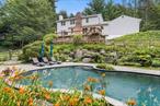 Discover an exceptional lifestyle at 233 Upper Shad Road, a picture-perfect 4-bedroom, 3.5-bath Colonial set on 2 beautifully landscaped acres in one of Pound Ridgeâ€™s most scenic and serene settings. This private haven blends classic architecture with resort-style amenities and thoughtful updatesâ€”offering the best of both worlds: peaceful country living with city convenience. From the moment you arrive, youâ€™re surrounded by nature and serenity. Spend your summer days lounging by the stunning in-ground Gunite pool with stone decking and lush gardens, host sunset dinners on the multi-tiered deck, or relax by the stone patio overlooking the expansive, level yardâ€”all framed by lush greenery and complete privacy. Inside, the bright, updated kitchen with center island and all-new cabinets, quartz countertops and appliances opens to a sun-filled family room with fireplace, creating a natural flow for everyday living and entertaining. French doors lead directly outside, connecting the interiors to your outdoor oasis. Upstairs, the serene primary suite is accompanied by three additional spacious bedrooms and a full bath. The versatile walk-out lower level with full bath and direct pool/yard accessâ€”is perfect for a guest suite, home gym, office, or media lounge. A nature lovers dream-with access to the Westchester Wilderness Walk Trails/Zofnass Family Preserve from your back yard to enjoy the scenic trails and outdoor adventures. Ideally located just minutes from quaint Scotts Corners, Bedford, New Canaan, and the dynamic City of Stamford and only one hour from NYC! This home is the perfect full-time residence or weekend escape. Close to major highways, Metro-North, and Westchester Airport. Whether you&rsquo;re seeking a forever home or a luxury retreat, this Pound Ridge gem delivers a rare combination of privacy, convenience, and effortless style. Recent upgrades include: 2025 - New roof and gutter system with covers, Brand-new kitchen cabinetry and appliances, freshly painted interiors, refinished hard wood floors in kitchen and family room, refinished exterior wood deck and stone patio/deck. Generator hook-up for peace of mind. Don&rsquo;t wait, this beauty will be gone!