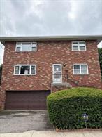 This beautiful brick Colonial is a legal two-family home with a finished, above-ground basement. Situated in Lincoln Park, it features spacious rooms, a sunken living room, and two full bathrooms in each of the 3-bedroom units. Additional highlights include a large concrete patio, a two-car garage, and abundant storage throughout. Finished Family room with a wet bar in the above ground basement