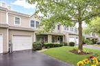 Embrace the ease of condo living in this spacious 2 bedroom, 2.5 bath home tucked away in Port Jefferson. This 2 story Townhouse features two Primary-sized bedrooms, both with en suite baths and walk-in closets, offering privacy and comfort. A modern white kitchen with quartz countertops is a perfect place for casual meals, and the fenced patio is large enough for outdoor dining, or just relaxing with friends or family. The attached one car garage is a plus, and there is ample guest parking close by. Port Jefferson Village is magical with its abundance of stores, restaurants and harborfront waterviews. Amenties for residents include Beach Rights and more! Common Charges include Cable TV, snow removal, landscaping & more. Taxes include PJ Village Tax. Close to 3 major hospitals and Stony Brook University. This is a must see!