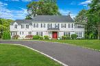 Step into timeless elegance at 5 Kohlsaat Courtâ€”One of the Historic homes in Smithtown, Built in the 1930s and owned by The Kohlsaat Family - a majestic Colonial estate nestled on a serene cul-de-sac in Smithtown. Celebrating over 5, 000 sqft of living space across a meticulously maintained residence built in 1935, this property offers 6 bedrooms, 4.5 baths, not including a separate Carriage House that features a legal 1 Bedroom apartment with a Balcony over a 2 car garage. The refined layout of this home exemplifies thoughtful designs for both entertaining and tranquility. Annual Taxes are less than $18k!Be welcomed by a grand staircase foyer framed by rich hardwood floors. Entertain formally in stately living and dining rooms, with a robust Chef&rsquo;s Kitchen and Pantry, cozy up by one of four fireplaces, or enjoy a morning coffee in the bright eat-in kitchen. Unwind at the end of the day in the stately primary bedroom, equipped with an en-suite bathroom, grand fireplace, and an enclosed three-season veranda. With period architecture enhanced by modern comforts such as central air, steam-radiator heating, and multiple en-suite bedrooms, the home blends historic charm with updated living of natural gas heating and updated roof of 2025! With an updated roof, you can do solar! The attic has it&rsquo;s own full staircase as well as the laundry room is on the 2nd floor!Set on more than one landscaped acre, the outdoor retreat includes an in-ground pool, patios, and porch space surrounded by mature plantings and irrigation. Want a Horse? This land has horse rights as well! Additional amenities include the aforementioned detached two-car garage with carriage house above it (1 Bedroom, kitchen, and living space) with it&rsquo;s own cesspool and powered by electricâ€”and a property configuration that once served as chauffeurâ€™s quarters.Located within the acclaimed Smithtown Central School District and offering excellent neighborhood access to parks, shops, and major routes, this property is exceptional in both location and legacy.