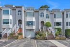 Welcome to an exceptionally styled Arbor model in the highly desirable gated community of Oak Park at Douglaston! This approx. 1, 576 sq. ft. condo offers 3 bedrooms, 3 beautifully renovated bathrooms, a modern kitchen with quartz countertops, stainless steel appliances, and custom cabinetry. Enjoy a bright living room, dining area, and cozy family room with sliders leading to your outdoor patio.Additional features include an office, laundry area, garage, driveway, hardwood floors, recessed lighting, crown moldings, updated CAC, and a striking cultured stone accent wall. Set on a quiet, tree-lined street with beautifully landscaped surroundings and unobstructed views, this home is just minutes from the LIRR, express bus to Manhattan, major highways, shopping, and much more. A rare opportunity to enjoy suburban comfort with city convenienceâ€”move right in!